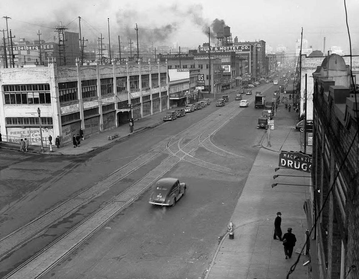 A view of Pacific Avenue looking north from the corner of South 24th Street (Puyallup Ave. one block east) in January 1941. MacKenzie’s Pharmacy, now the site of Berliner Beerhall, is on the bottom right.