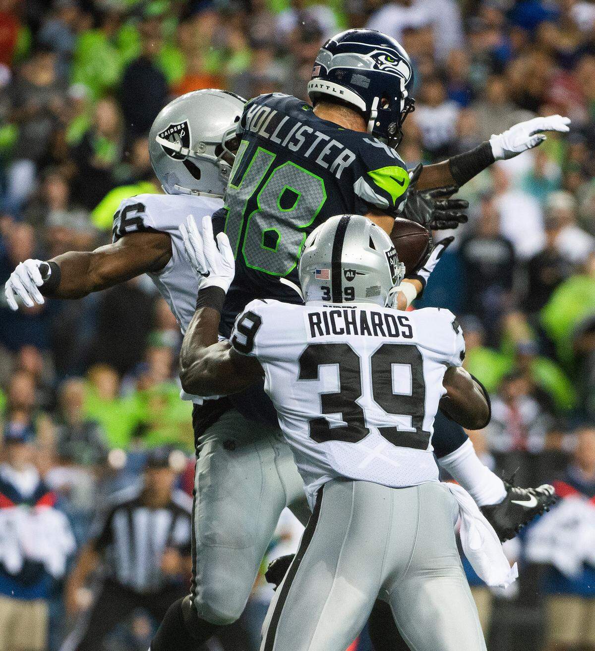 Seattle Seahawks tight end Jacob Hollister (48) pulls down a touchdown pass during the second quarter. The Seattle Seahawks played the Oakland Raiders in a National Football League game at CenturyLink Field in Seattle, Wash., on Thursday, Aug. 29, 2019.