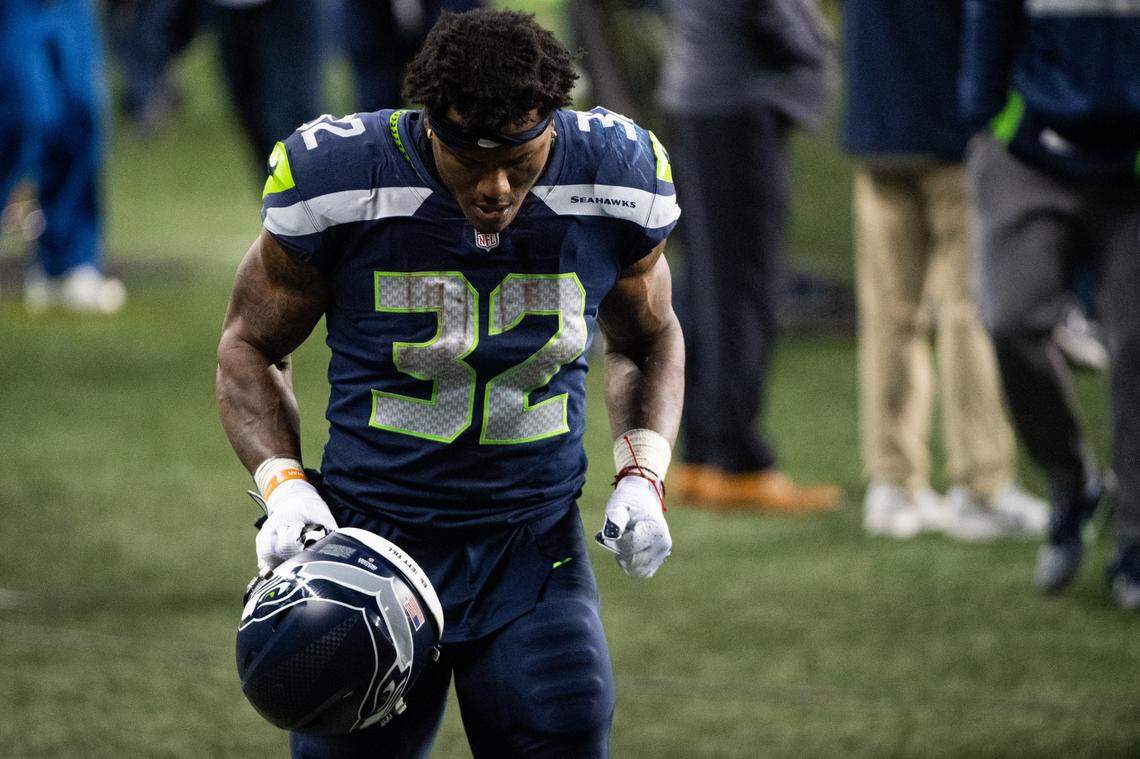 Seattle Seahawks running back Chris Carson walks off the field after the game. The Seattle Seahawks played the Los Angeles Rams in a NFL wildcard playoff game at Lumen Field in Seattle, Wash., on Saturday, Jan. 9, 2021.