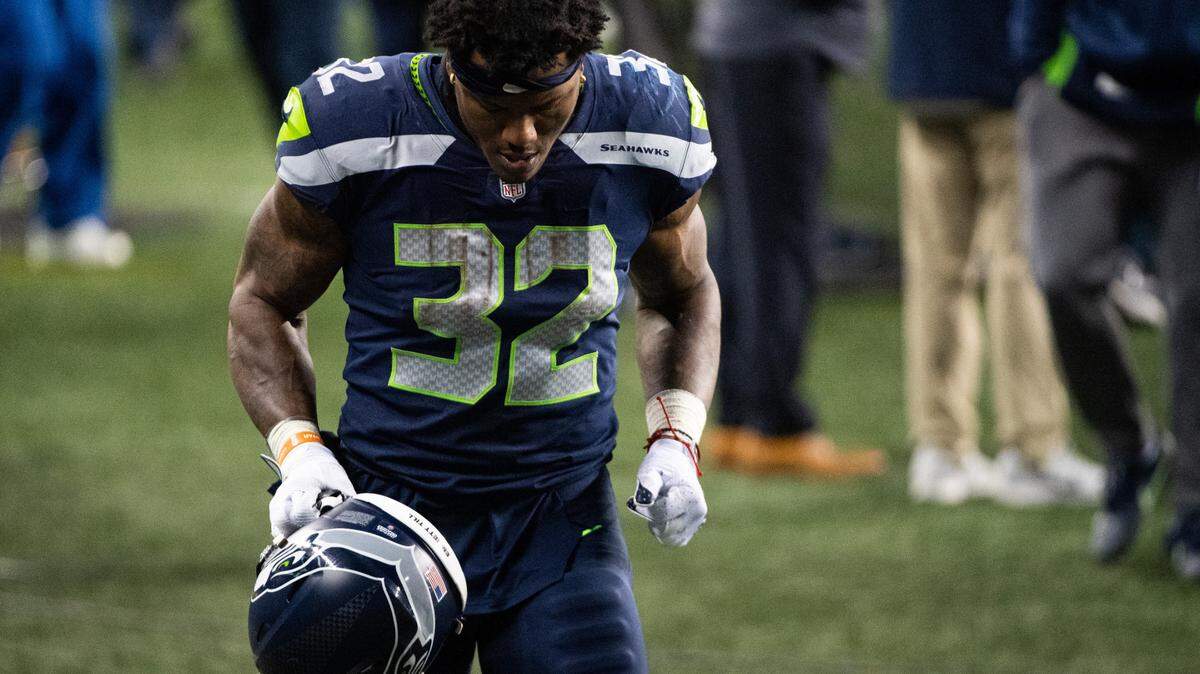 Seattle Seahawks running back Chris Carson walks off the field after the game. The Seattle Seahawks played the Los Angeles Rams in a NFL wildcard playoff game at Lumen Field in Seattle, Wash., on Saturday, Jan. 9, 2021.