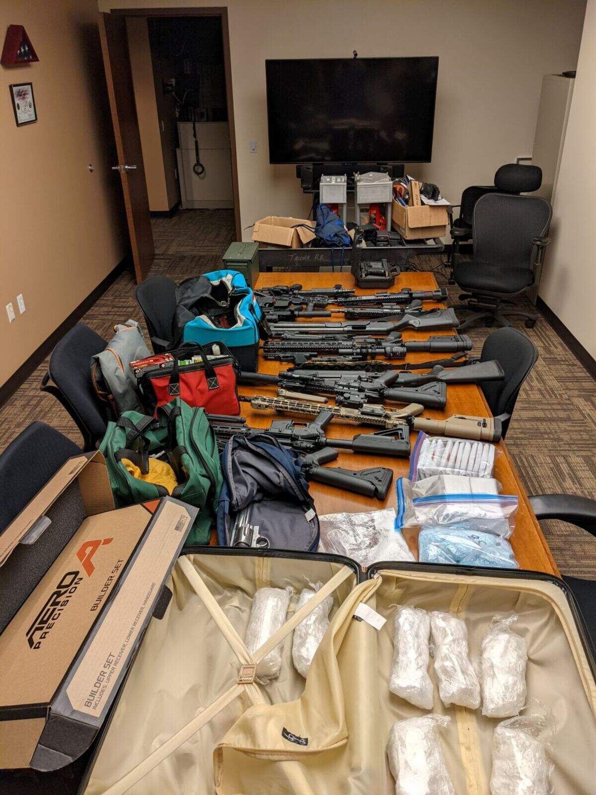 This image shows firearms and other items that were seized by the FBI in the arrest of Jesse and Candace Bailey.