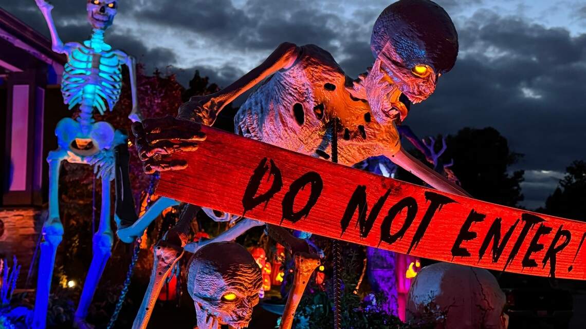12-foot skeletons are taking over Tacoma neighborhoods and climbing over chimneys