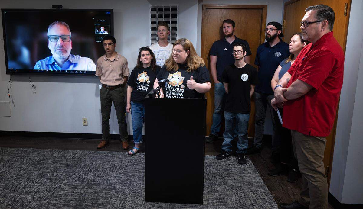 Ann Dorn of Tacoma For All is flanked by Tacoma workers as she speaks at a press conference in University Place, Washington, on Wednesday, Aug. 2, 2023. Tacoma For All filed a lawsuit against the City of Tacoma over the City Council’s addition of an alternative measure to the group’s Tenants Rights Initiative and won that suit on Aug. 30, 2023. Now the organization is alleging several housing and realtor associations violated state law when campaigning against their ballot measure.
