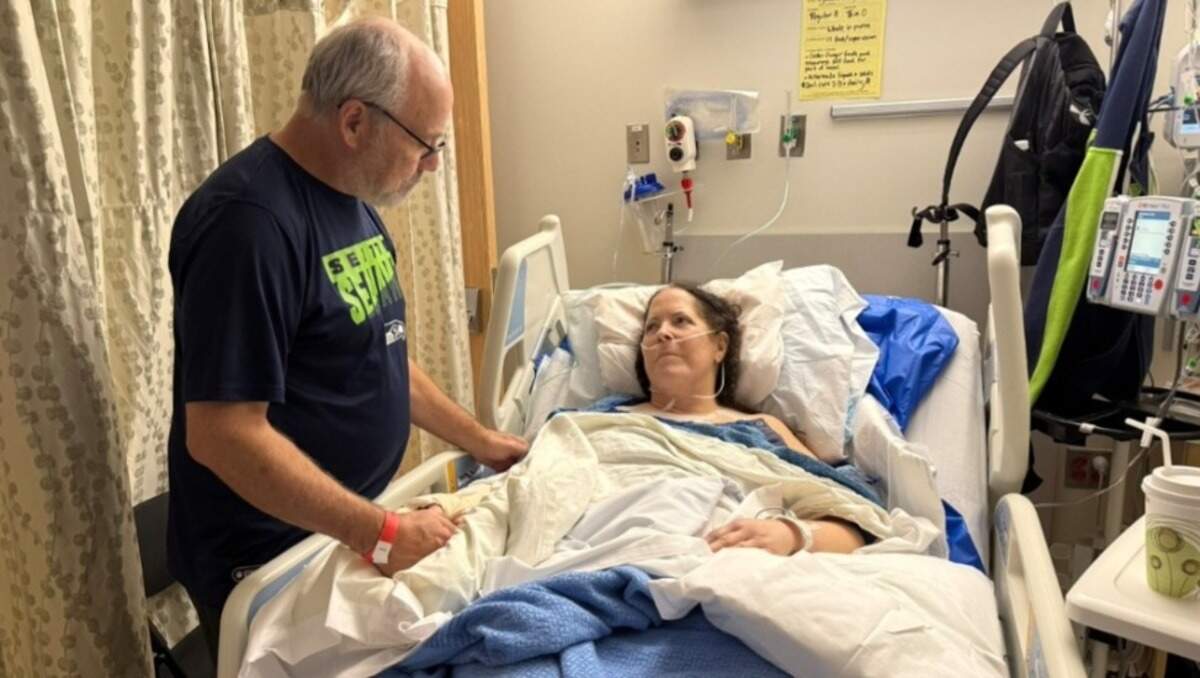 Bill Morgan with his wife Cindy Morgan in the hospital after a head-on wreck on Monday, Nov. 10, 2025 near Pateros, Wash. left her with broken bones and other serious injuries
