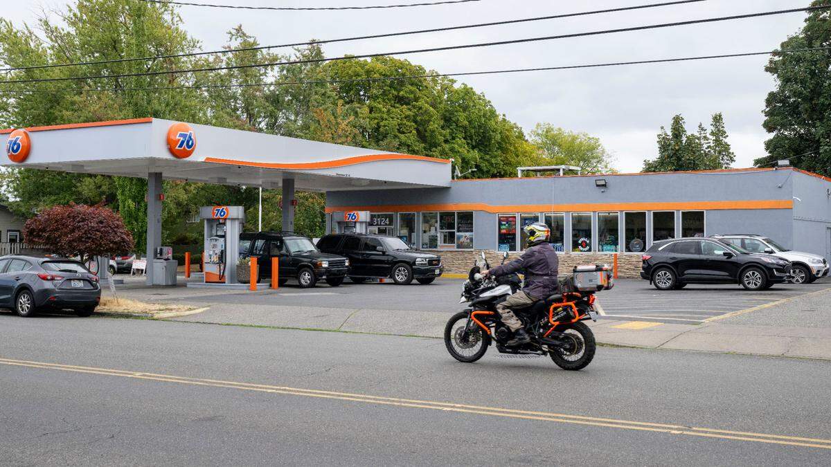 A motorcyclist rides past the Alder 76 gas station, where Italy Paola had operated as a food truck, on Wednesday, Aug. 30.