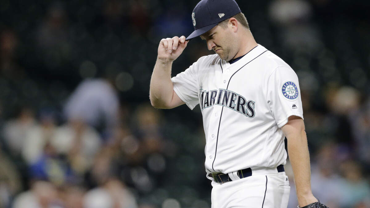 Seattle Mariners right-handed reliever Adam Warren walks off the field after being removed during the seventh inning of the team’s baseball game against the Baltimore Orioles on Tuesday, Sept. 4, 2018, in Seattle. (AP Photo/John Froschauer)