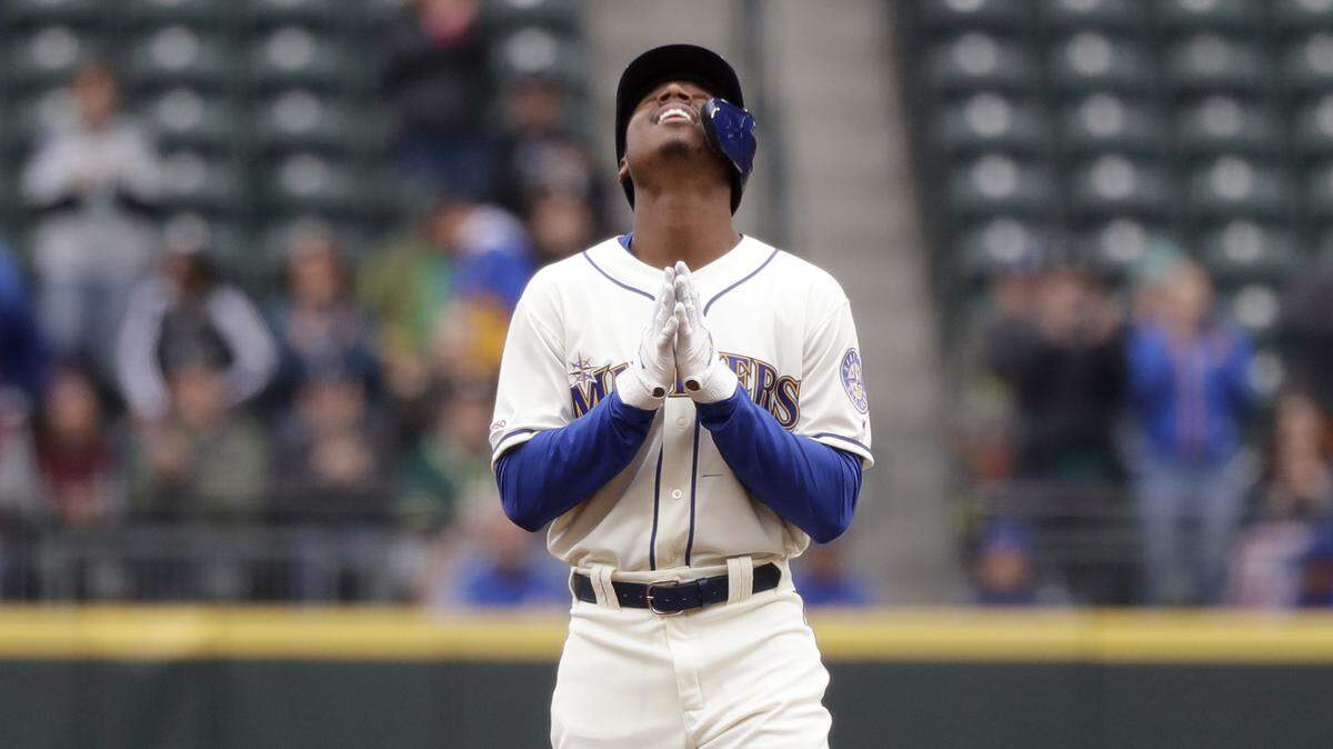 Seattle Mariners’ Kyle Lewis stands on second base and looks skyward after hitting a double against the Oakland Athletics in the first inning of a baseball game Sunday, Sept. 29, 2019, in Seattle.