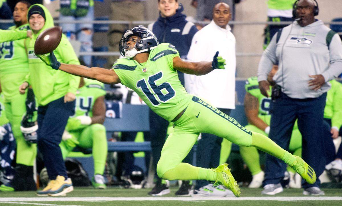 Seattle Seahawks wide receiver Tyler Lockett lays out but comes up short on a pass attempt from quarterback Russell Wilson during the NFL’s Thursday Night Football game against the Los Angeles Rams at Lumen Field in Seattle, Washington, on Oct. 7, 2021. The Rams won the game, 26-17.