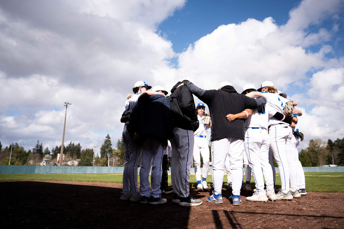 Stadium players and couches huddle before the game agains Mount Tahoma at Heidelberg Field, on Tuesday, April 9, 2024, in Tacoma, Wash.