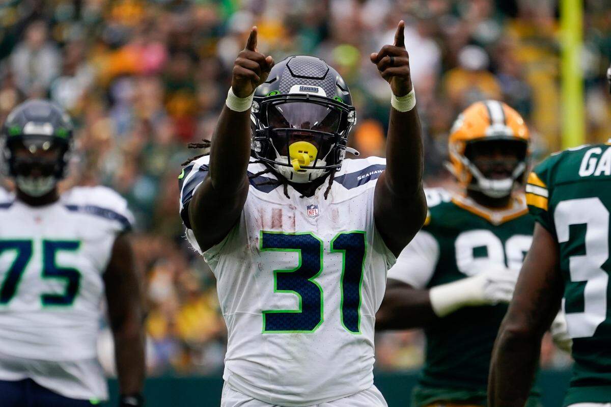 Seattle Seahawks running back DeeJay Dallas (31) celebrates after a run in the first half of a preseason NFL football game against the Green Bay Packers, Saturday, Aug. 26, 2023, in Green Bay, Wis. (AP Photo/Kiichiro Sato)