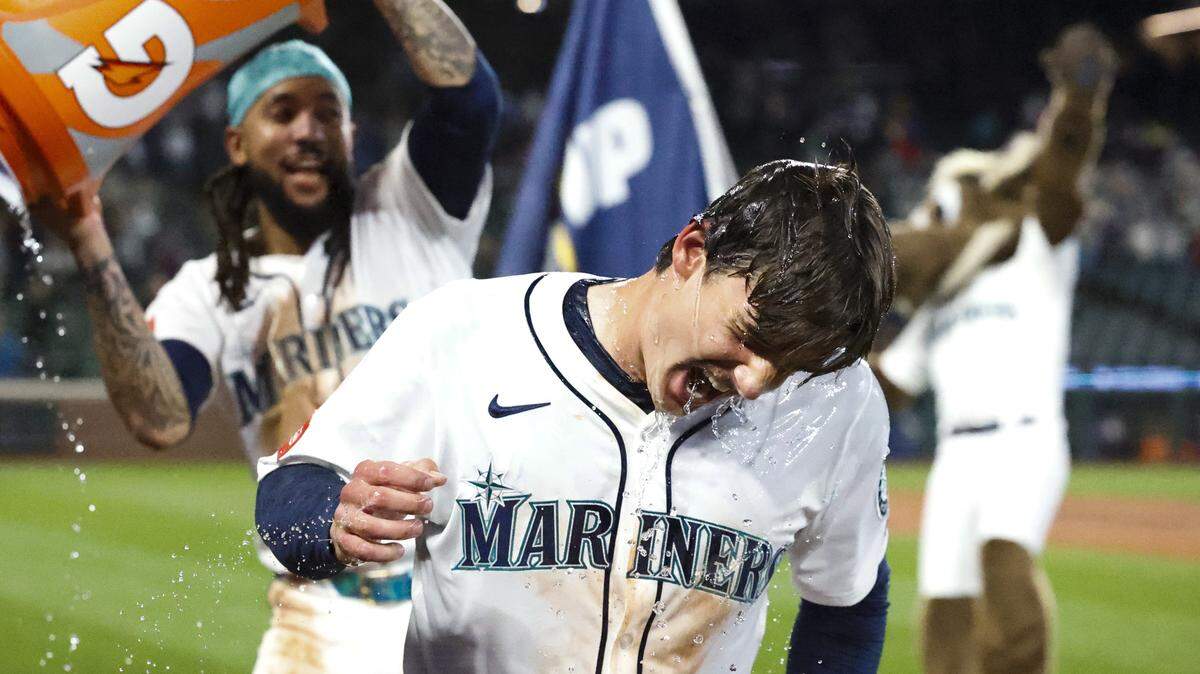 May 31, 2025; Seattle, Washington, USA; Seattle Mariners second baseman Cole Young (2) celebrates following a walk-off RBI-fielders choice against the Minnesota Twins during the eleventh inning at T-Mobile Park. Mandatory Credit: Joe Nicholson-Imagn Images