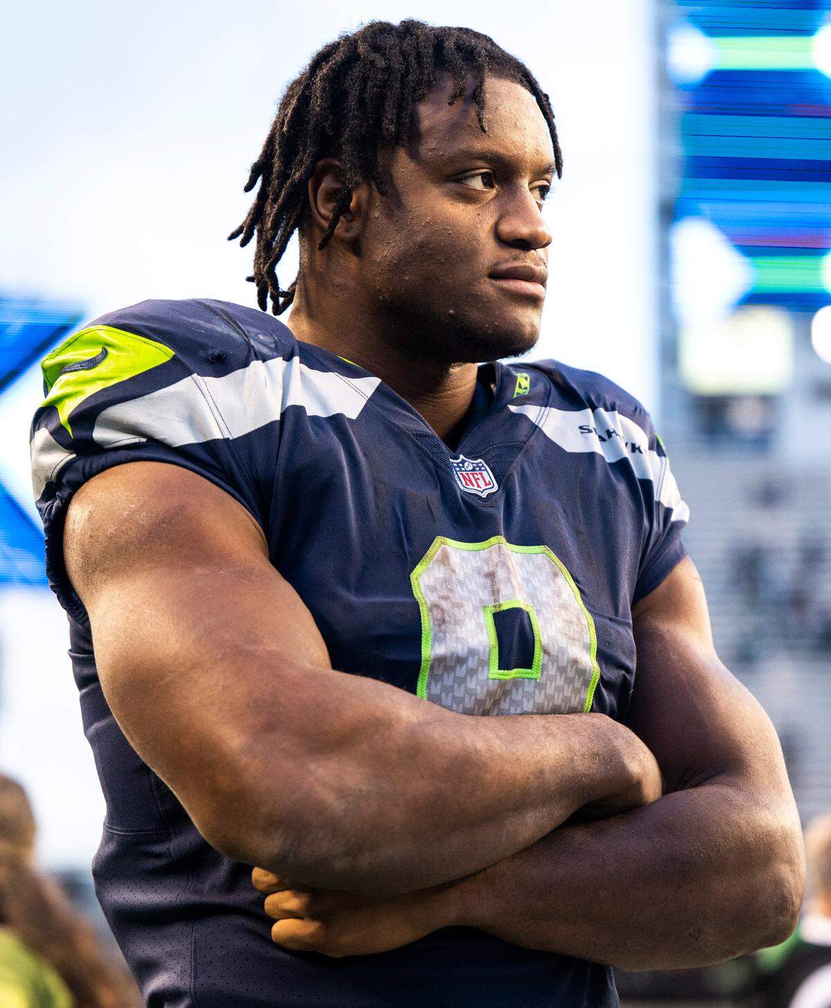 Seattle Seahawks running back Kenneth Walker III (9) talks to a New York Jets player on the field after an NFL game at Lumen Field in Seattle Wash. on Jan. 1, 2023. The Seahawks defeated the Jets 23-6.