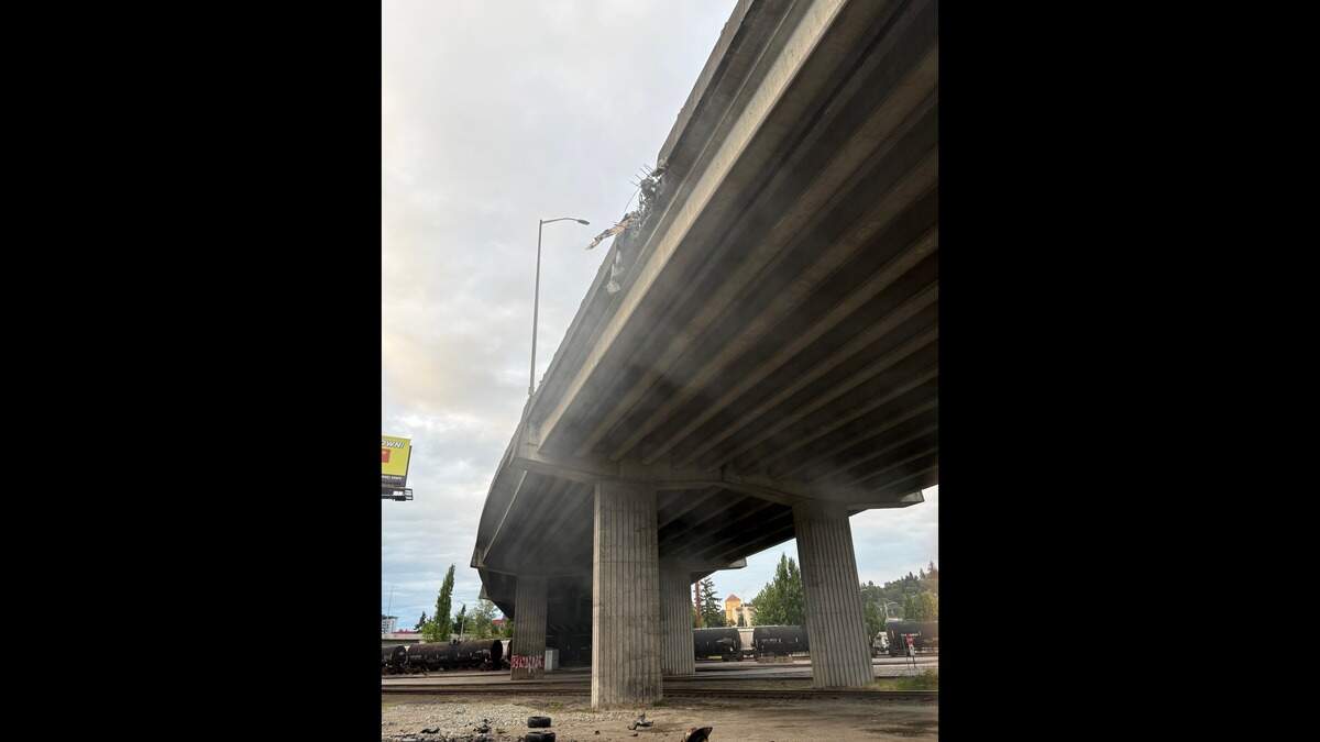 A hole was left in the side of the Portland Avenue overpass near Cleveland Way when police say a person drove off the bridge and crashed onto the ground below. The driver was found dead in the vehicle.