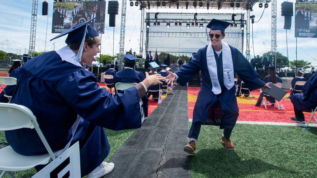 A 2021 Mt. Tahoma High School graduate celebrates at last year’s outdoor ceremony. For 2022, events return to Tacoma Dome, where thousands of students from several Pierce County districts and their families will take part in commencements June 13-18.