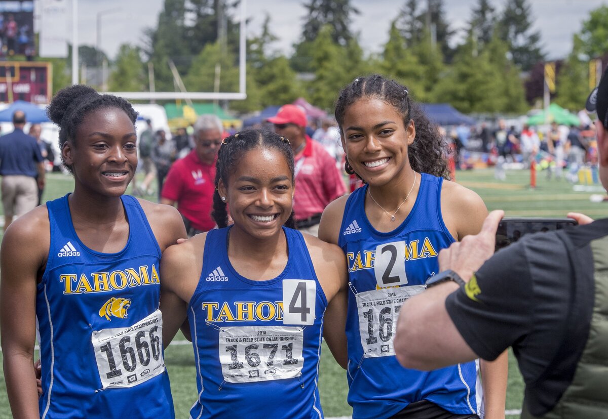 Tahoma’s three entrants in the girls 4A 100 meter dash finals pose afterward at the state 2A, 3A, 4A Track & Field Championships held at Mt. Tahoma High School, May 26, 2018. Left to right they are Adaji Osaro-Igwe, Aliya Wilson, and Alisha Wilson.