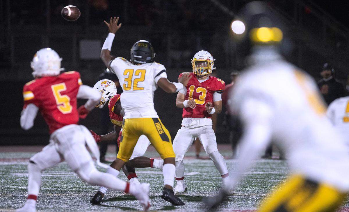 Mount Tahoma quarterback Tre Walker hits wide receiver Deonjae Ervin with a pass during Friday night’s football game against the Lincoln Abes at Mount Tahoma High School in Tacoma, Washington, on Sept. 20, 2023. Mount Tahoma won the game, 24-20.