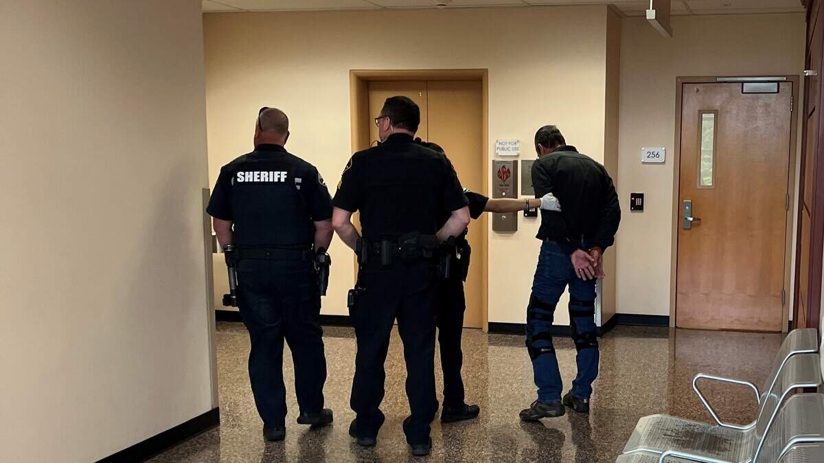 Pierce County sheriff’s deputies serve an arrest warrant from Grays Harbor County on Michael Joseph Basse at the County-City Building in Tacoma on Thursday, May 25, 2023. Basse faces multiple child-sex crimes in both counties.