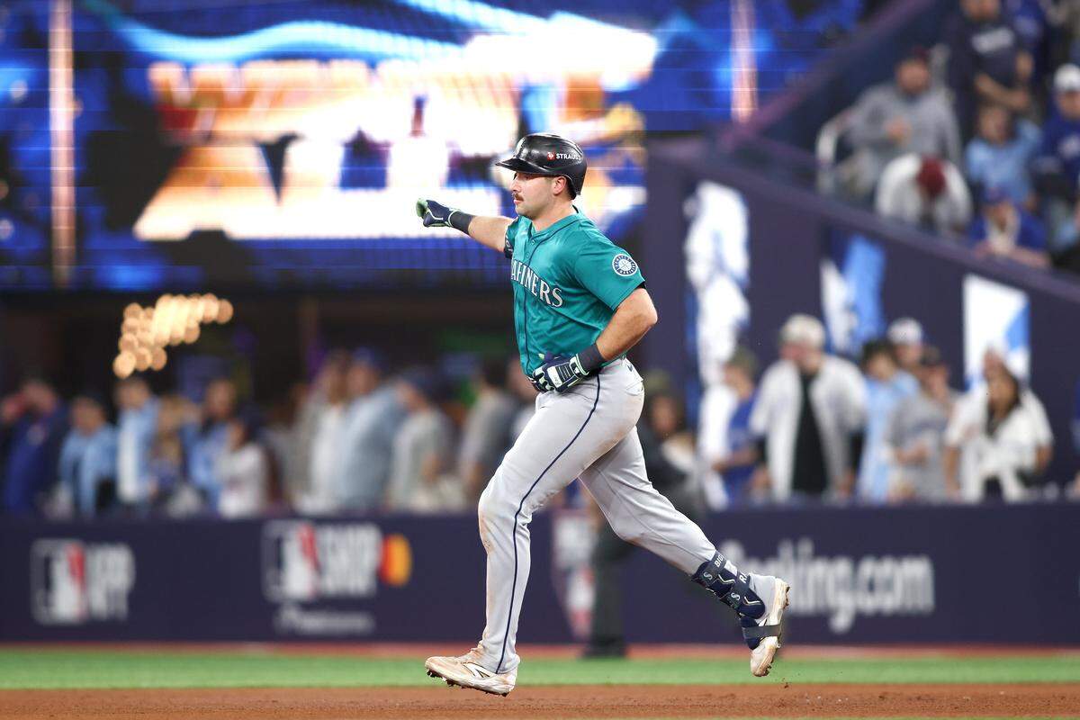 TORONTO, ONTARIO - OCTOBER 12: Cal Raleigh #29 of the Seattle Mariners rounds the bases after hitting a solo home run during the sixth inning against the Toronto Blue Jays in game one of the American League Championship Series at Rogers Centre on October 12, 2025 in Toronto, Ontario. (Photo by Cole Burston/Getty Images)