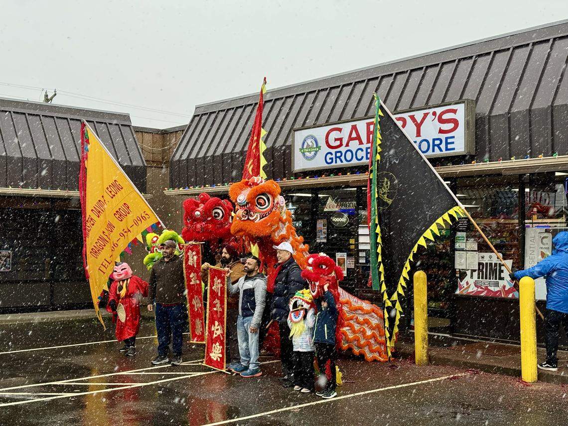 Tacoma’s Lincoln District has hosted a Lunar New Year festival since 1990. Lion dancers wander through the street and visit each business throughout the day. They are shown here with staff at Garry’s Groery Store at 522 S. 38th St. on Sunday, Feb. 2, 2025.