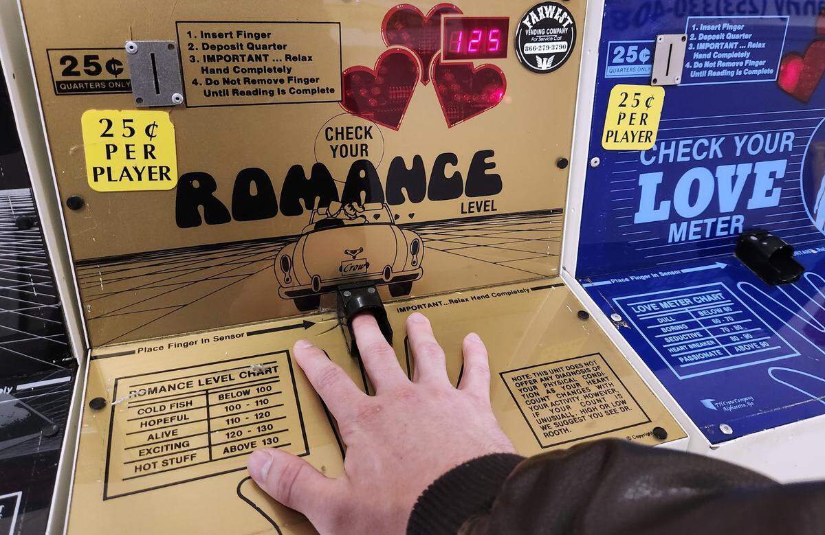 Reporter Jared Gendron gets his assessment from the romance level tester at B&I Public Marketplace in Lakewood, Washington, on Wednesday, June 9, 2023.