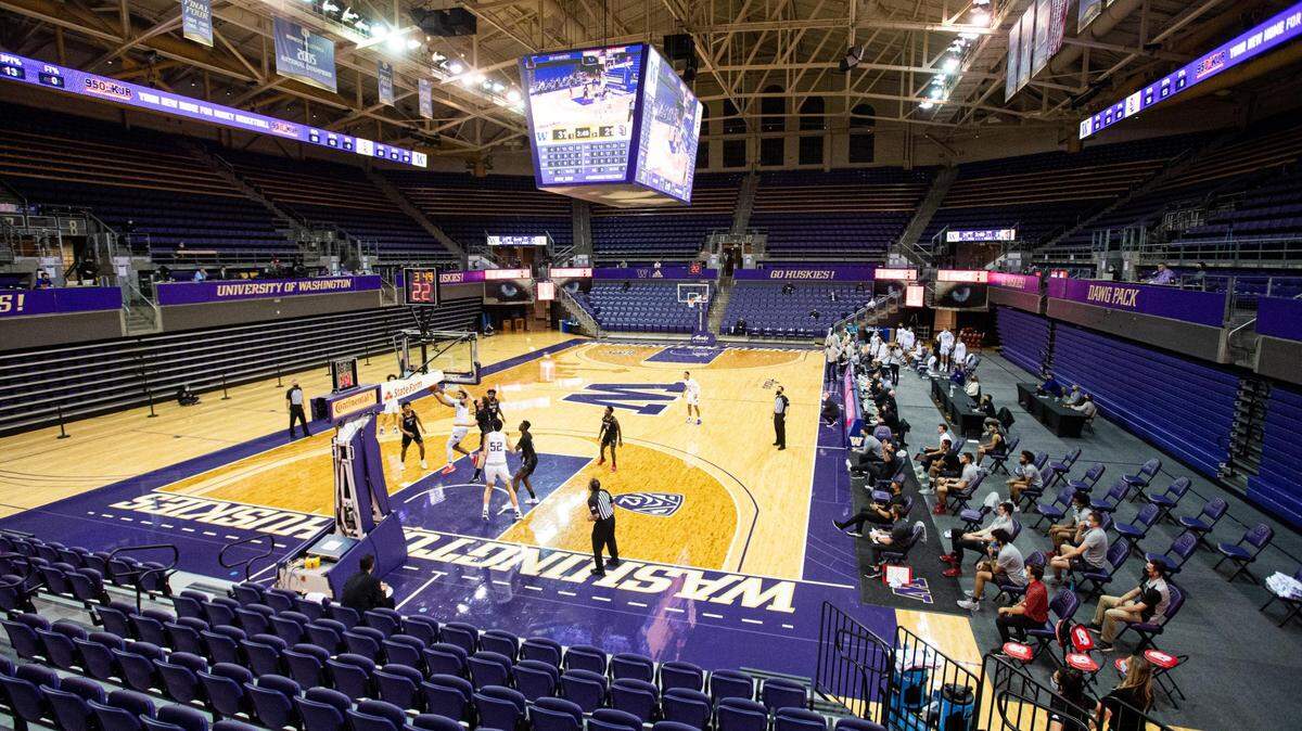 Washington’s Jamal Bey drives to the basket in an empty stadium in the second half. The Washington Huskies played the Seattle University Redhawks in a NCAA basketball game at Hec Edmundson Pavilion in Seattle, Wash., on Wednesday, Dec. 9, 2020.
