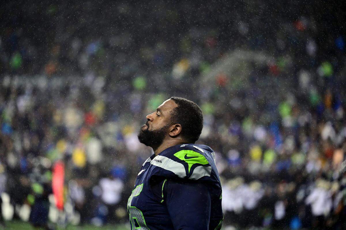 Seattle Seahawks offensive tackle Duane Brown (76) grimaces while rain begins to pour down after the Seahawks lost to the Saints, 13-10, in an NFL game on Monday night at Lumen Field in Seattle.