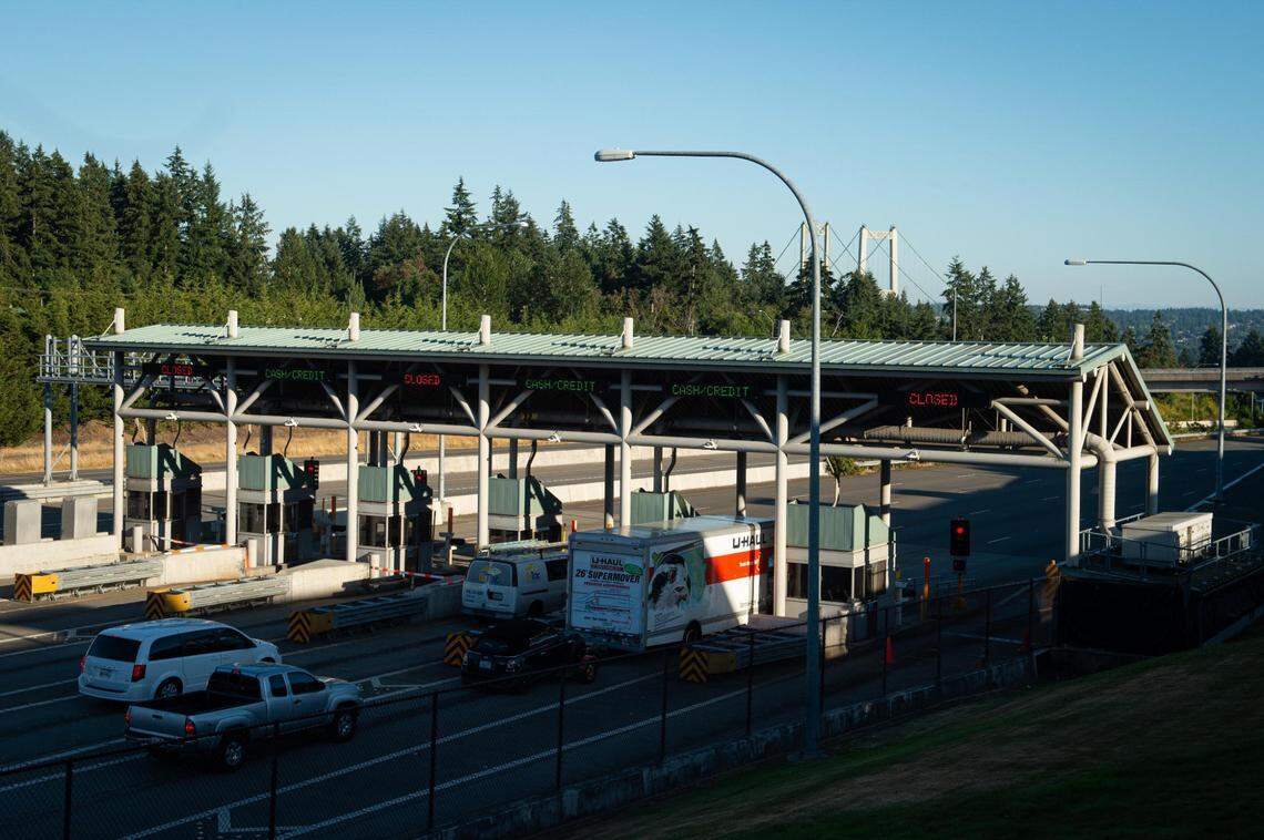 Cars pull up to the toll booths near the Tacoma Narrows Bridge in Gig Harbor, Wash., on Monday, July 20, 2020.