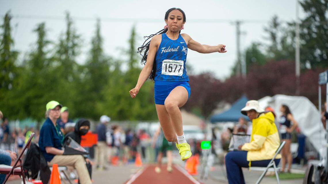Federal Way’s Cassandra Atkins leaps toward the pit during the 4A girls triple jump final at the State 2A, 3A, 4A track and field championships on Thursday, May 26, 2022, at Mount Tahoma High School in Tacoma Wash. Atkins won the event with a best jump of 38 feet, 1.5 inches.