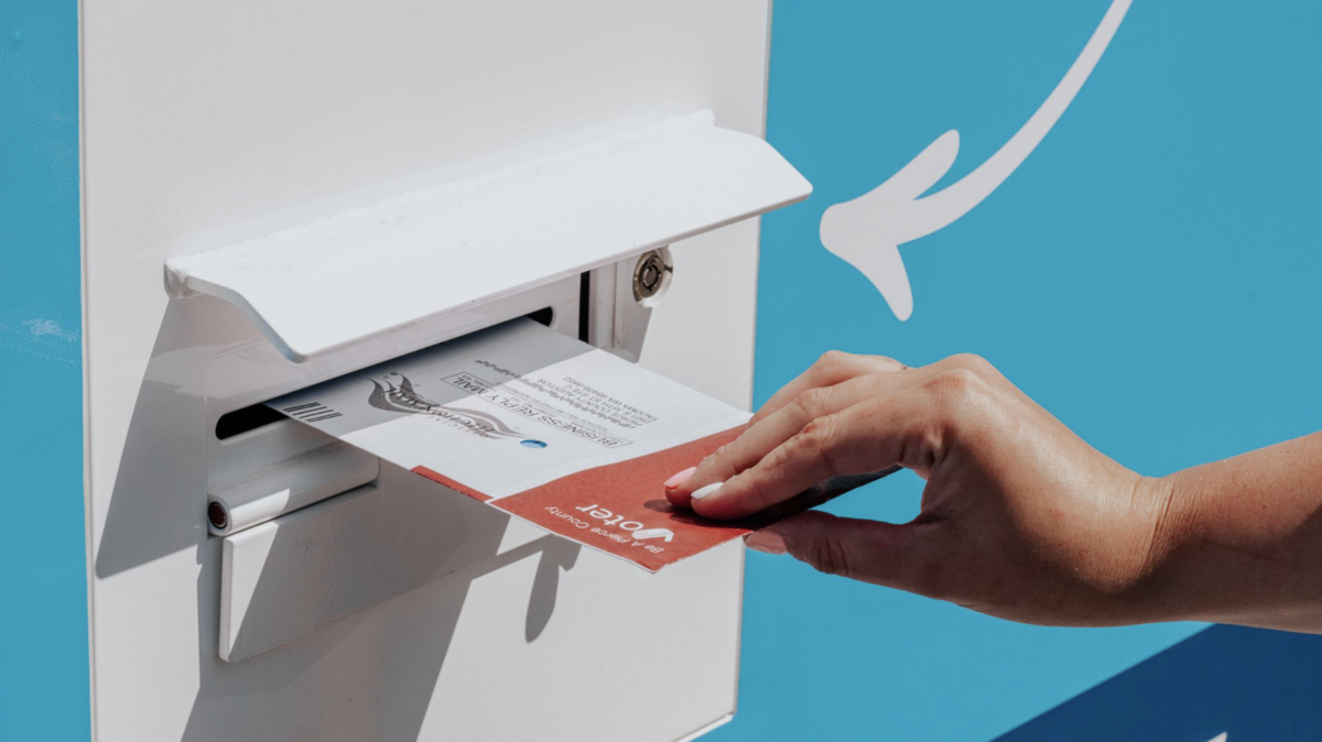 A person drops off their ballot in Pierce County.