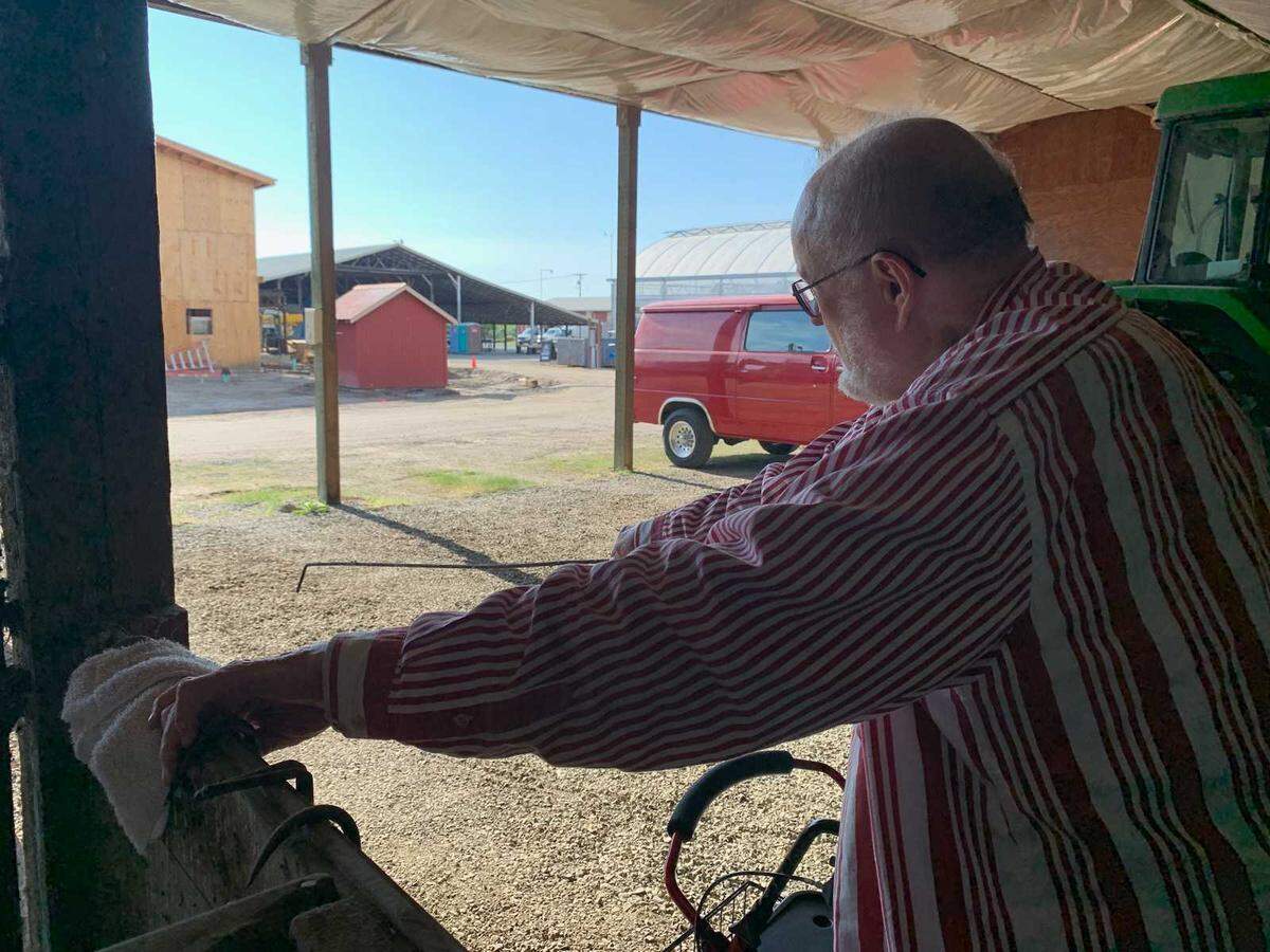Neil Van Lierop looks out at his historic farmland, now the site of Farm 12 and the headquarters of its parent nonprofit Step By Step.
