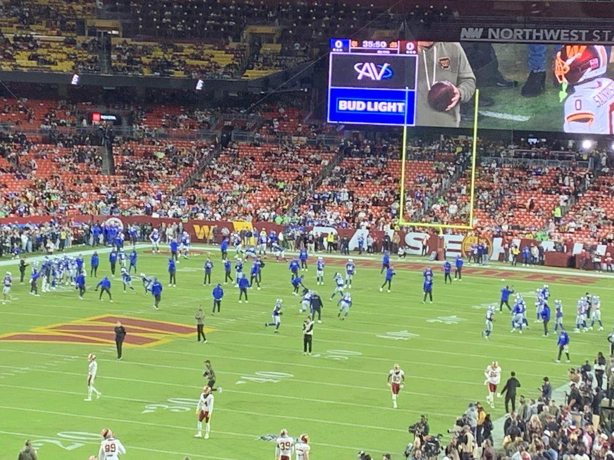 The Seahawks in throwback royal-blue-over-silver uniforms warm up to play at the Washington Commanders in Landover, Maryland, Sunday, Nov. 2, 2025.