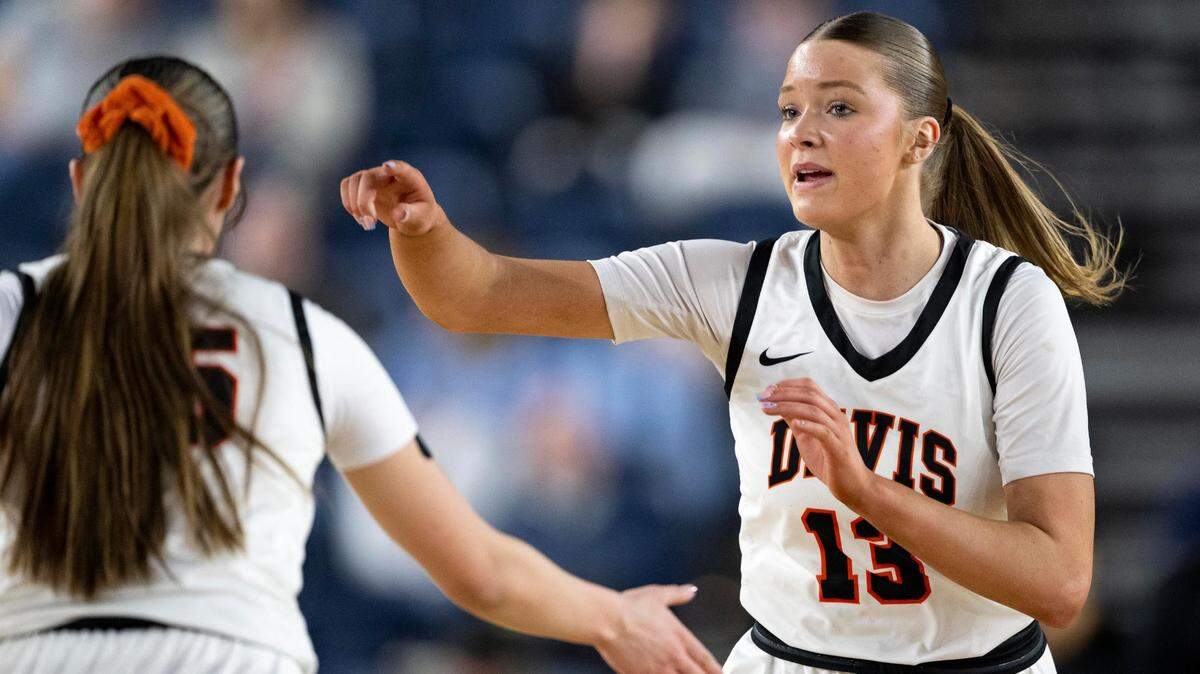 Davis guard Cheyenne Hull (13) jogs back on defense along with teammate guard Nevaeh “Deets” Parrish (15) during the first quarter of the Class 4A state championship game at the Tacoma Dome on Saturday, March 8, 2025, in Tacoma, Wash.