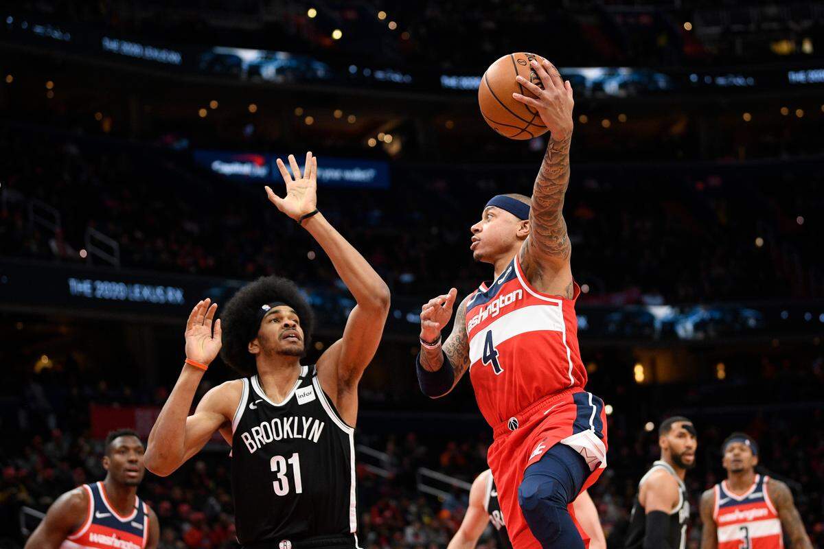 Washington Wizards guard Isaiah Thomas (4) shoots against Brooklyn Nets center Jarrett Allen (31) during the first half of an NBA basketball game, Saturday, Feb. 1, 2020, in Washington. (AP Photo/Nick Wass)