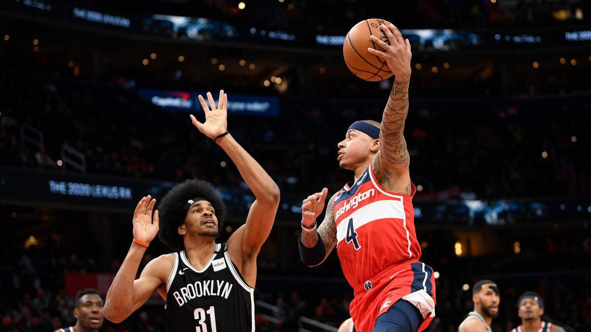 Washington Wizards guard Isaiah Thomas (4) shoots against Brooklyn Nets center Jarrett Allen (31) during the first half of an NBA basketball game, Saturday, Feb. 1, 2020, in Washington.