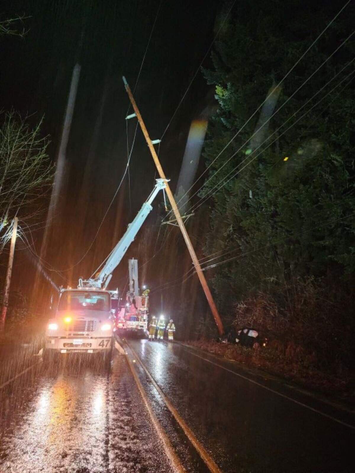 Peninsula Light Co. makes repairs to a transmission pole which was damaged in a car wreck. About 3,000 residents are without power until it’s repaired.