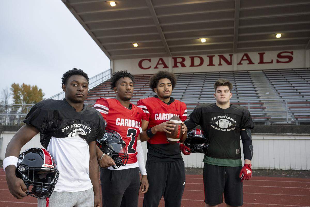 Franklin Pierce players, from left, running back Ja'mire Ford, running back Bryson Allen, quarterback Jeremiah Orcutt, and running back Forrest Dolan, stand for a portrait at Franklin Pierce Stadium on Wednesday, Nov. 12, 2025, in Tacoma, Wash.