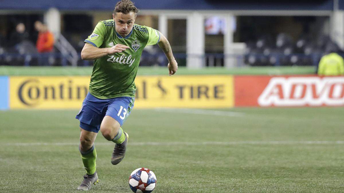 In this Feb. 20, 2019, photo, Seattle Sounders forward Jordan Morris drives against Club Nacional during the second half of an international friendly soccer match in Seattle. Twelve months after suffering a torn ACL in his right knee, nearly 18 months since he last played a full 90 minutes for either club or country, Morris is back on the field trying to prove his run of bad injury luck was just a fluke and rediscover his spot as part of America’s soccer future. (AP Photo/Ted S. Warren)