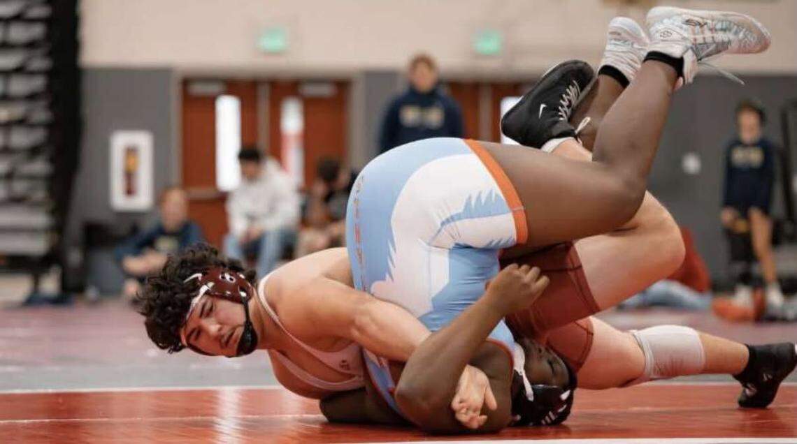 Toppenish senior and two-time Mat Classic champion Anthony Nava (left) was selected to The News Tribune’s 2025 Class of Untouchables.