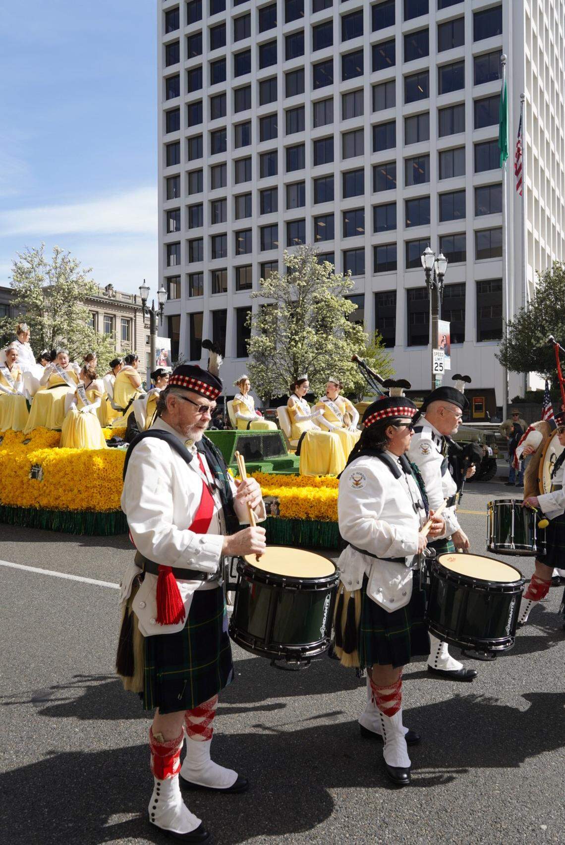 Drummers from the Clan Gordon Pipe Band get in position before the start of the Daffodil Festival Parade in Tacoma, Wash., on Saturday, April 5, 2025.