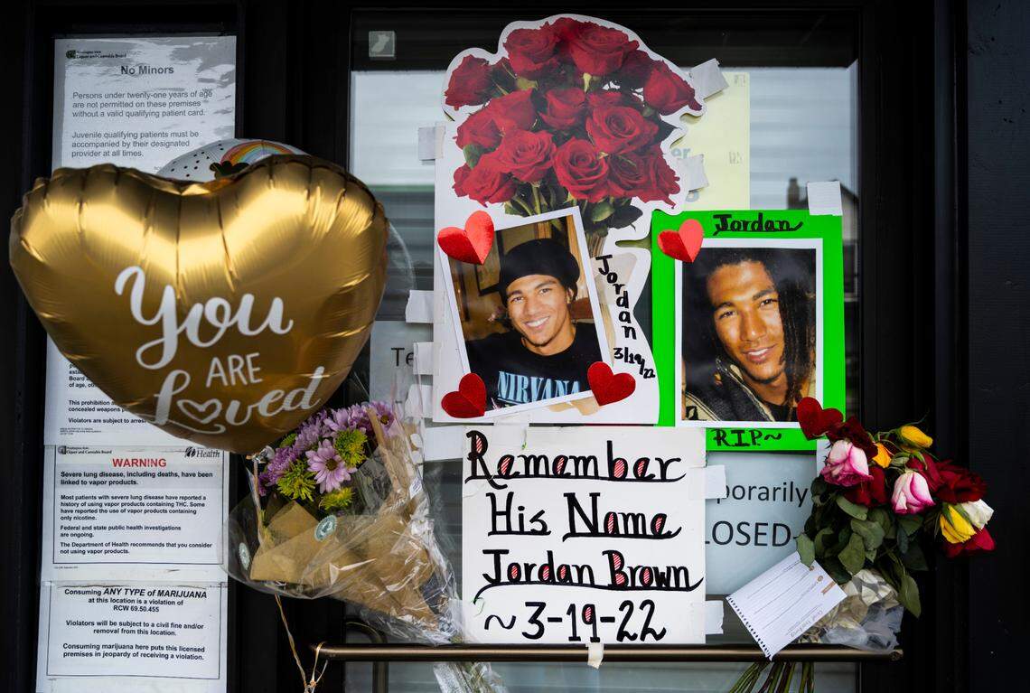A memorial for Jordan Brown sits outside of Wolrd of Weed on the 3200 block of East Portland Avenue in Tacoma, Wash. on Saturday, March 26, 2022. Brown was shot and killed in an armed robbery while working at the shop on March 19, 2022.