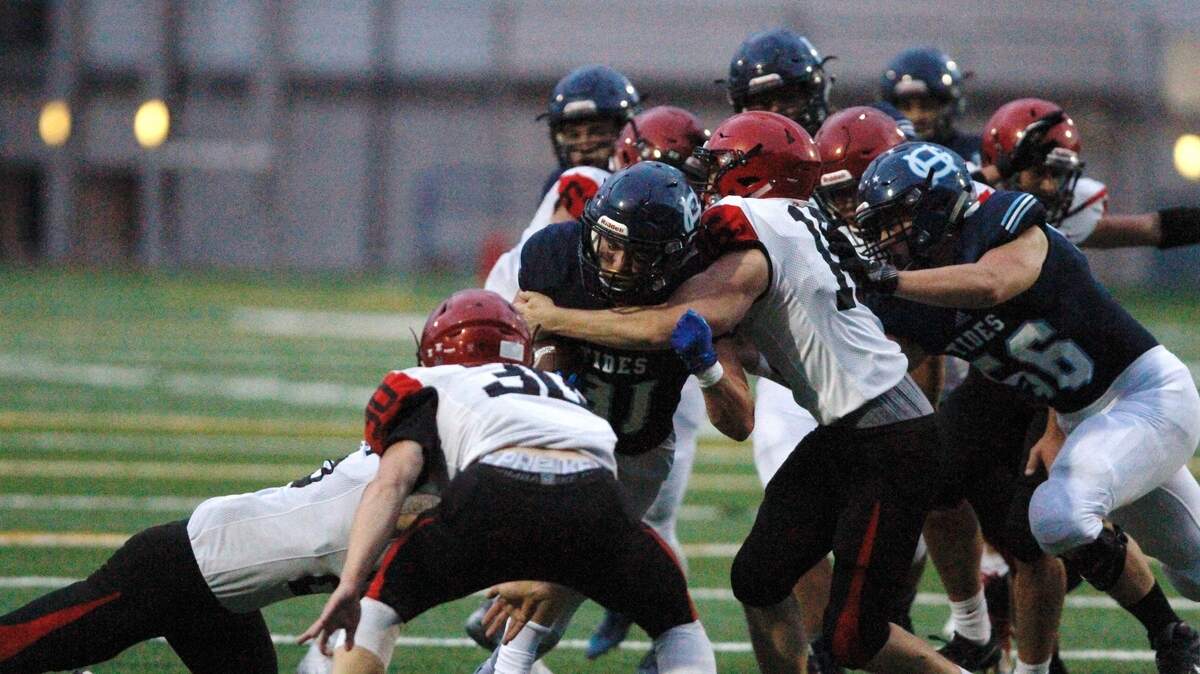 Gig Harbor running back Tom Williams scrapes for some yards against Yelm at Roy Anderson Field on Friday night.