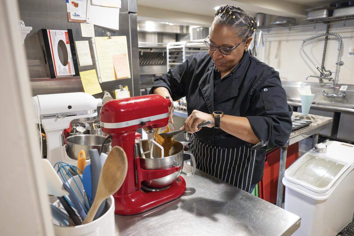 Regina Eudora Gray adds ingredients to the mixer as she prepares a batch of Kingdom cupcakes on Friday, Feb. 20, 2026, at Eudora's Bakery & Cafe in Tacoma, Wash.