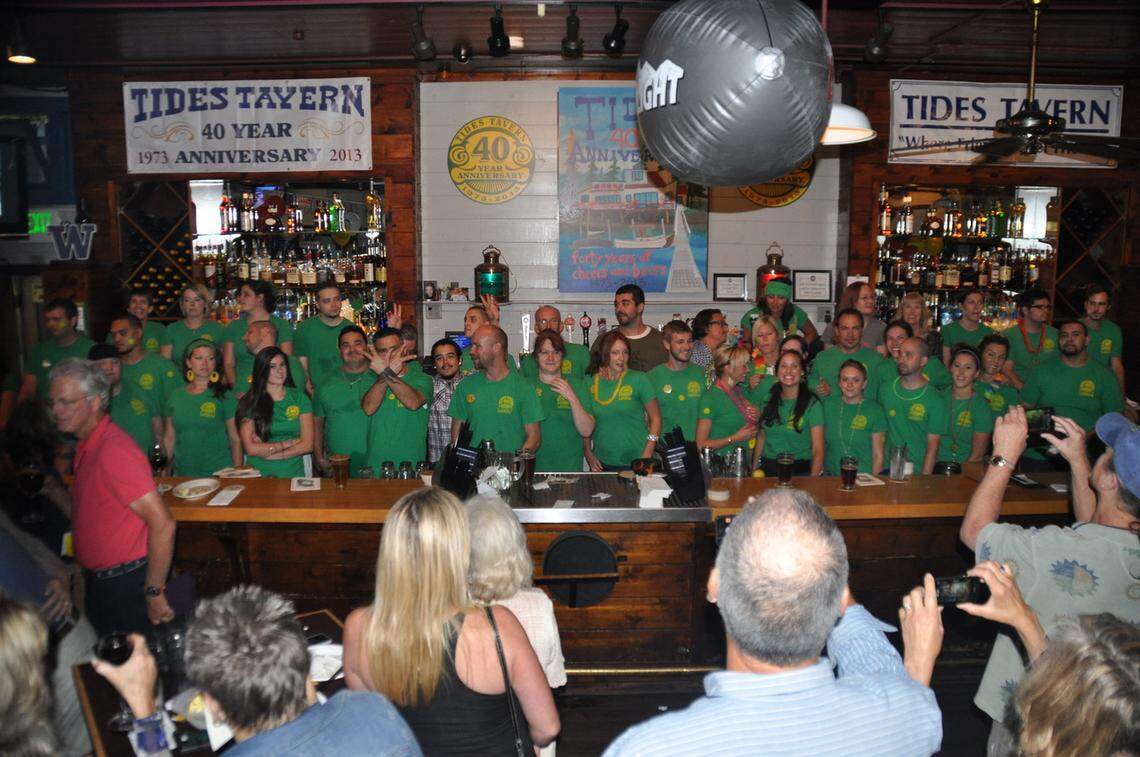 Tides Tavern staff at the bar’s 40th anniversary party in 2013. Many employees, including the longtime general manager, have been with the company for 10, 15 or even 25 years.