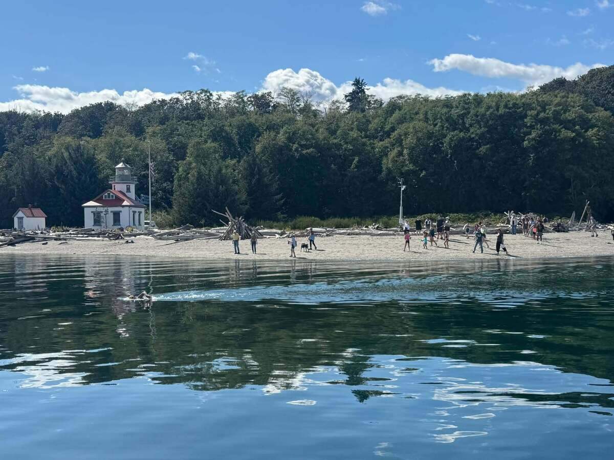 2. Mary Singer Courtesy Northwest Open Water Swimming Association.jpg Mary Singer passing Point Robinson Lighthouse on Wednesday, on her way to becoming the first person ever recorded to swim around Vashon Island.