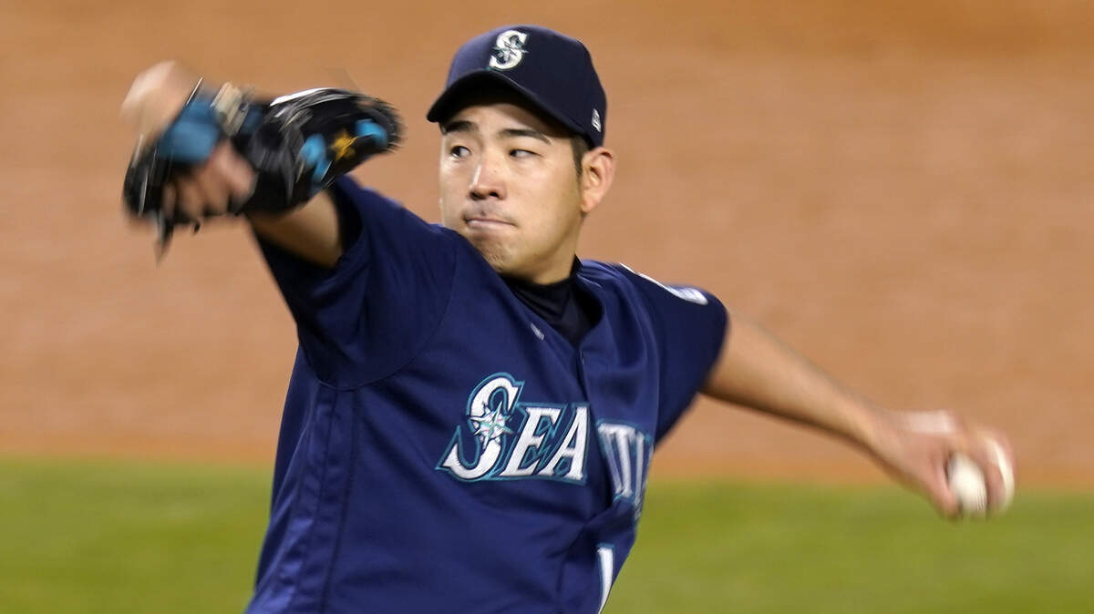 Seattle Mariners starting pitcher Yusei Kikuchi throws to the plate during the sixth inning of an interleague baseball game against the Los Angeles Dodgers Tuesday, May 11, 2021, in Los Angeles. (AP Photo/Mark J. Terrill)