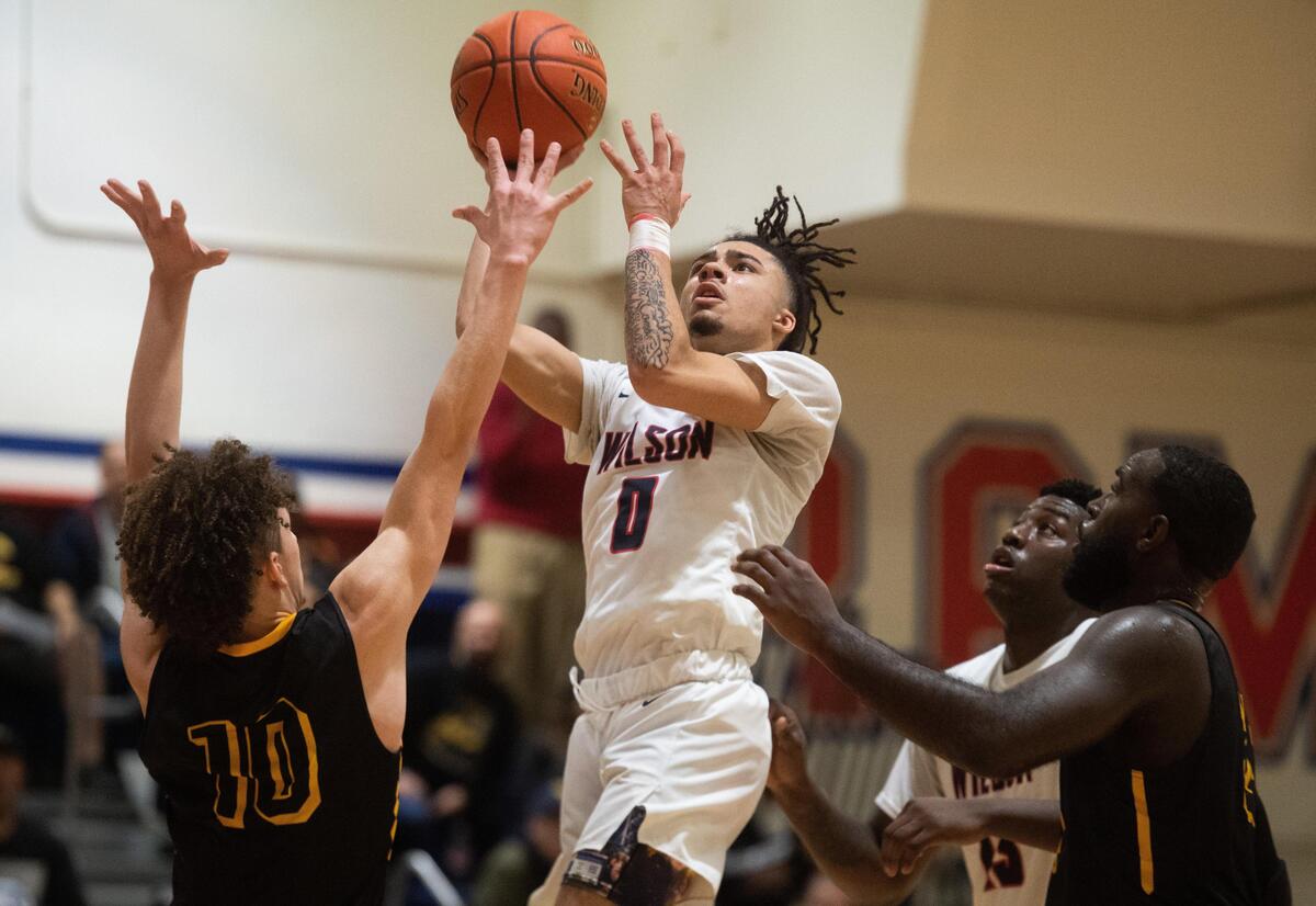 Wilson’s Damani Green shoots during the second quarter. Wilson played Lincoln in a basketball game at Wilson High School in Tacoma, Wash., on Thursday, Dec. 19, 2019.