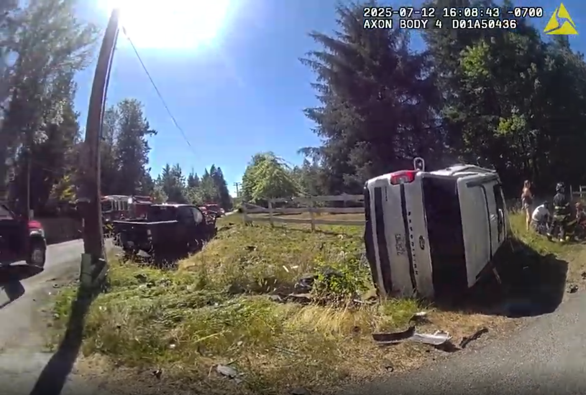 A still image from body-camera video shows the aftermath of a July 12, 2025 two-vehicle collision southeast of Graham where then-Maj. Chadwick Dickerson crashed his black Dodge Ram into a white Ford Expedition carrying a family of six.