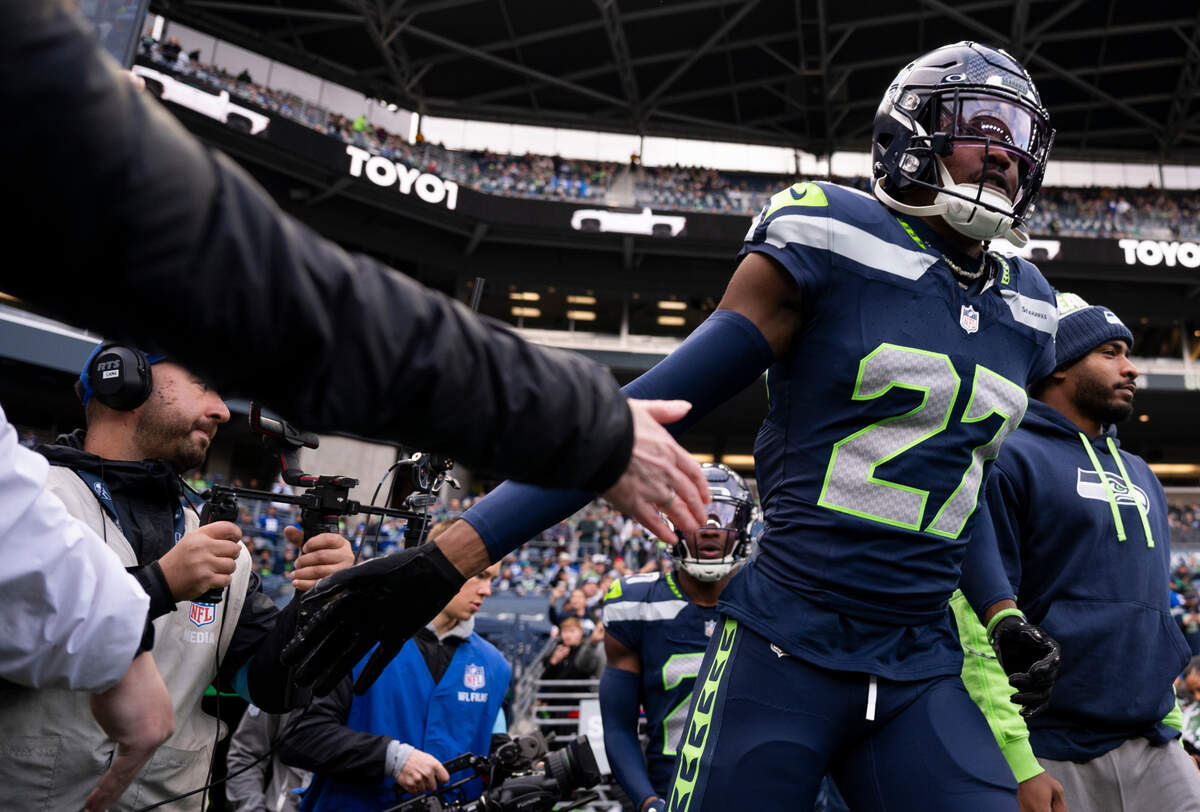 Seattle Seahawks cornerback Riq Woolen (27) runs out before the game against the Los Angeles Rams at Lumen Field, on Sunday, Nov. 3, 2024 in Seattle, Wash.