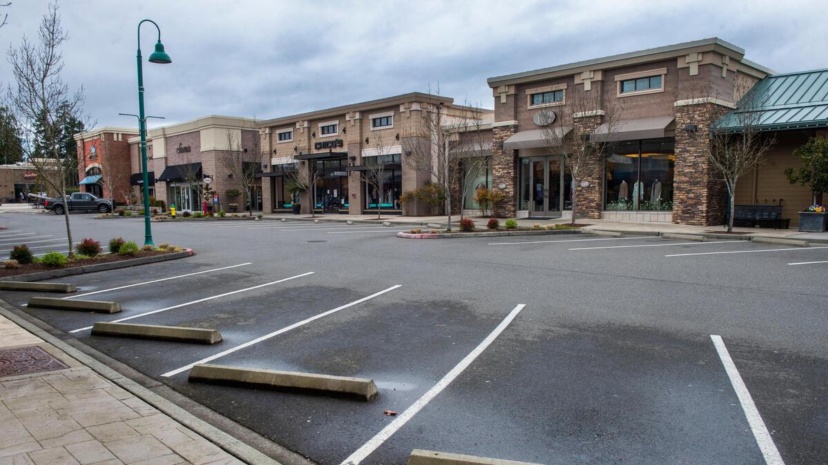 Deserted parking lots at the Uptown Gig Harbor shopping center, where most businesses have been shut down due to the coronavirus outbreak.
