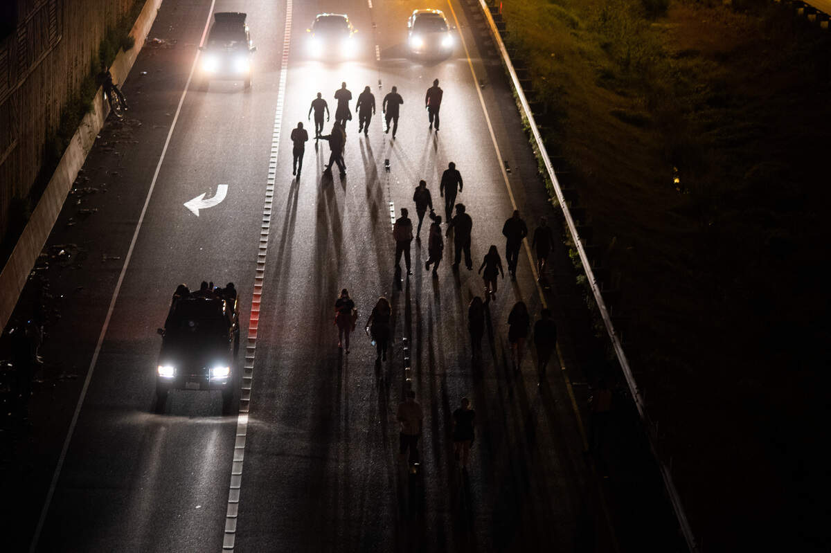 Protestors march down the SB-I5 exit ramp to 705 in Tacoma. Hundreds of protestors demonstrating in the wake of the George Floyd killing marched through the streets and demonstrated at intersections in Tacoma, Wash., on Monday, June 1, 2020.